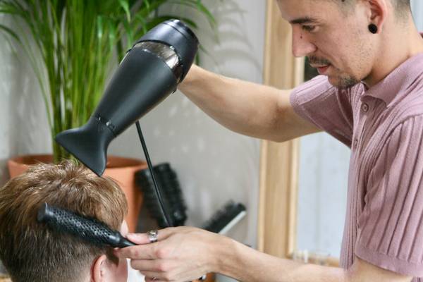 William Smith blow dries a customers hair photo supplied 600px
