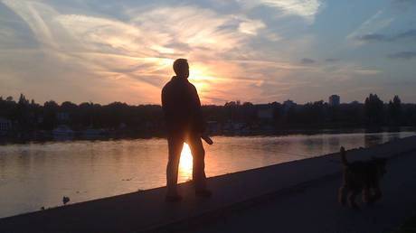 riverside park sunset man dog